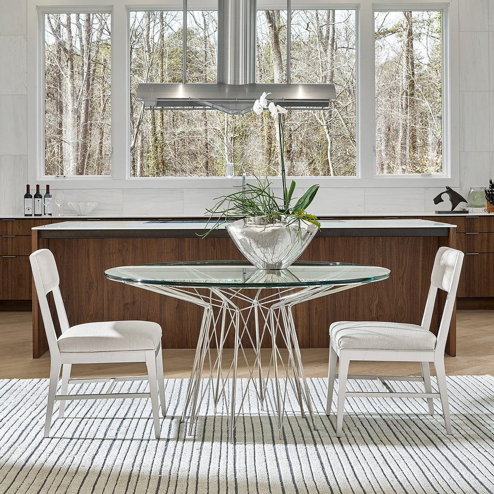 
                      
                        Axel Round Dining Table
                      
                    