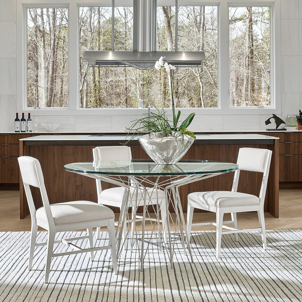 
                      
                        Axel Round Dining Table
                      
                    